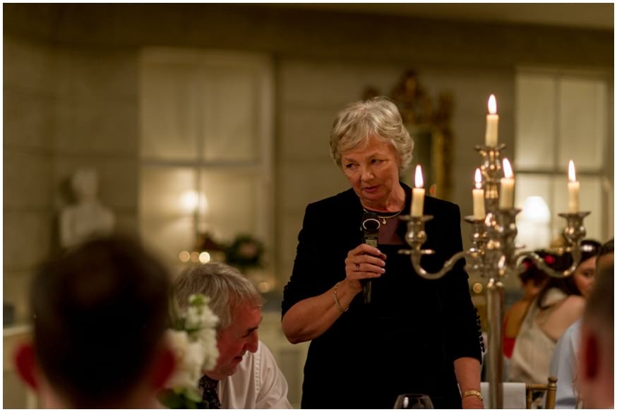 Mother of the bride giving a speech at reception 