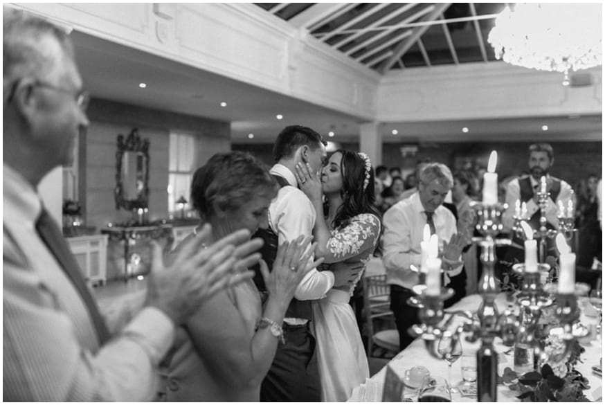 Bride and Groom kiss during the speeches at Tankardstown wedding venue