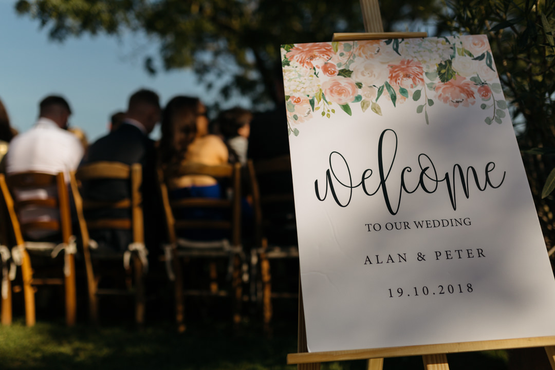 Elegant floral welcome sign wedding stationary at entrance of the ceremony 