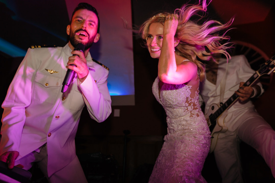 Bride dances with the lead singer from Spring Break wedding band 